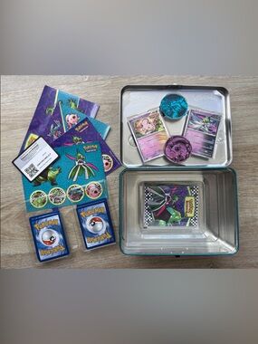 Pokémon Trading Card Tin with 62 Cards, 1 Portfolio, 2 Coins, 4 Sticker Sheets